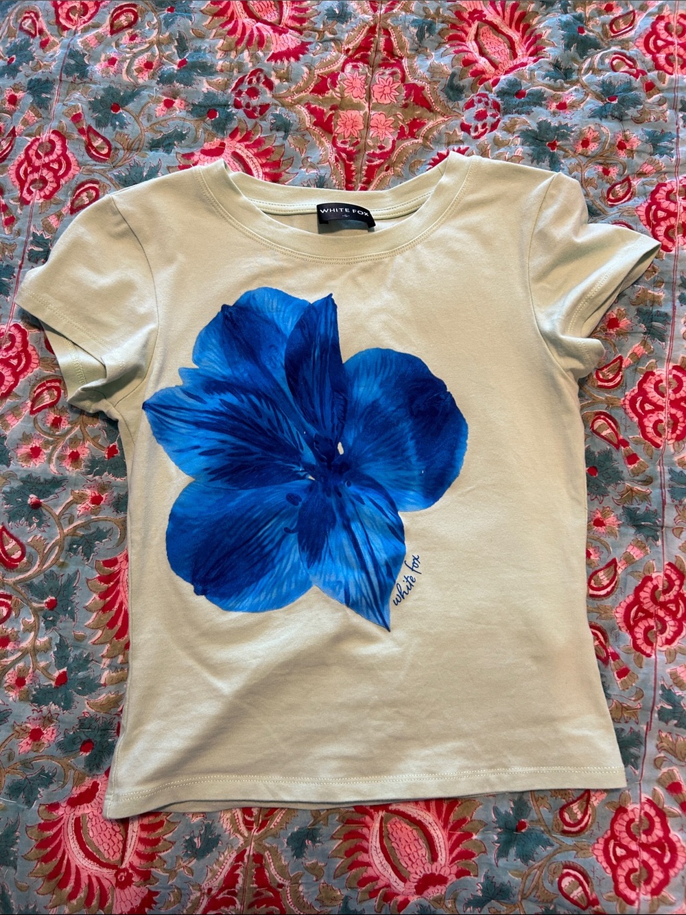 White Fox Boutique Green Short Sleeve Baby Tee with Bold Blue Floral